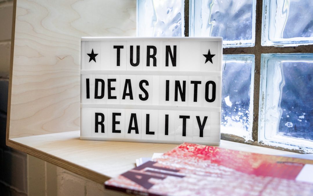 Sign saying "Turn Ideas Into Reality"